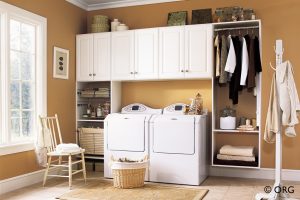 white laundry room cabinets with washer dryer