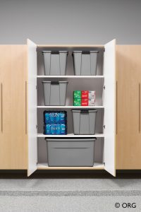 storage closet with drawers open and storage bins inside
