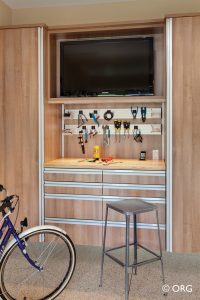garage storage with tv and stools