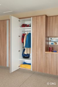 wooden garage closets with clothes inside