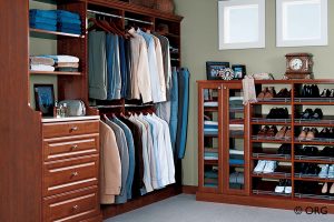 brown men's walkin bedroom closet with dress shirts