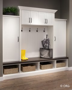 white shelves with coat racks and pull out storage bins