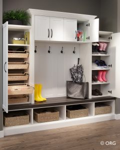 white custom shelves with coat racks and shoe storage