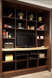 custom entertainment center with television and shelving cubes