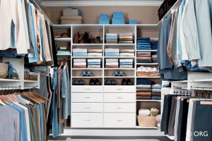 custom walk in closet with blue items