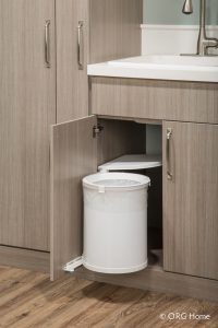 built in storage in cabinet with sink