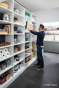 white pantry storage with man browsing