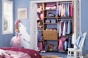 white closet door with brown custom shelving for kids room
